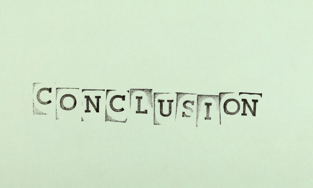 a green piece of paper with the word "conclusion" stamped onto it