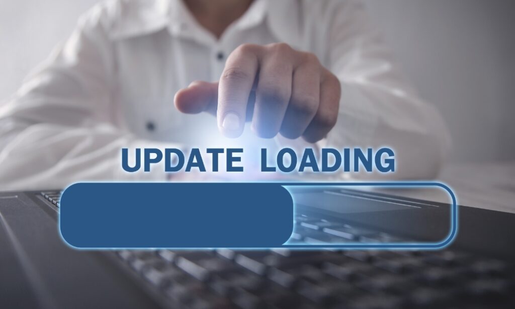 man at keyboard with image overlay of a update loading bar 