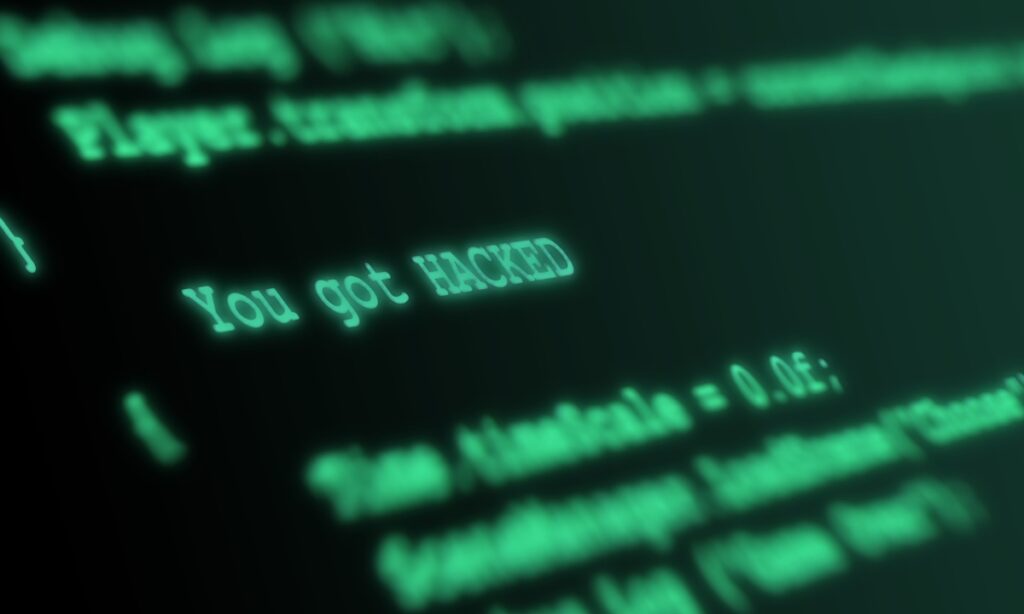 green letters on a black background, with all but three words blurred out; "you got hacked"