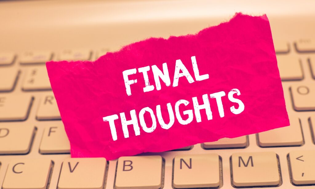 a small pink slip of paper sticking out of a laptop keyboard with the words "final thoughts" written on it