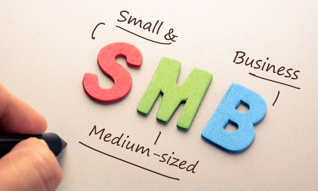 three letters (s, m, & b) with some words coming off of and explaining the acronym; "S" has "small &," "M" has "medium-sized," and "B" has "business," referring to small and medium sized businesses