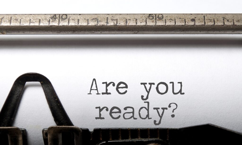 a typewriter that has spelled out "are you ready?"