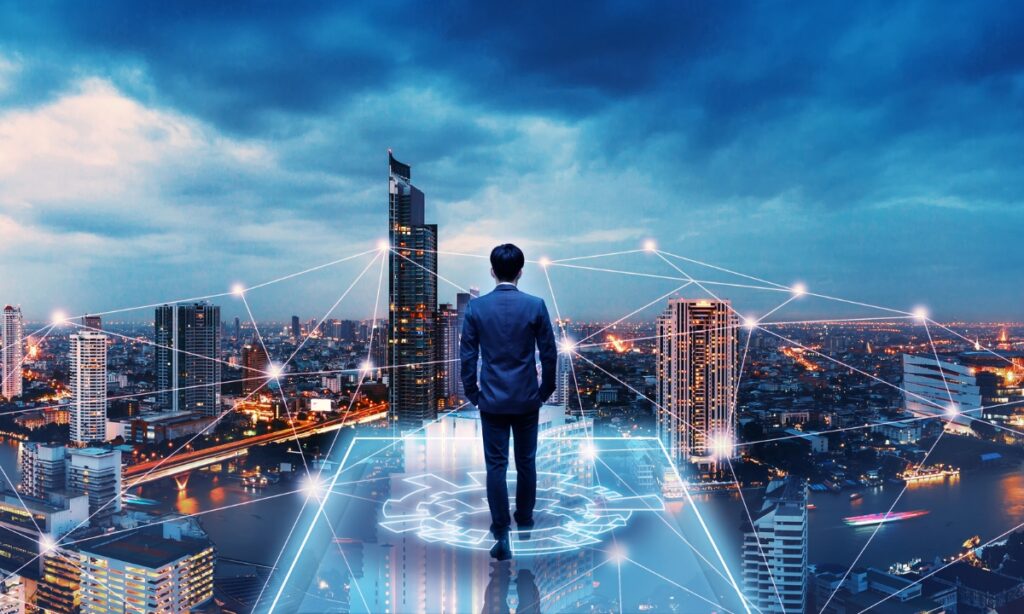 a man in a suit standing on the edge of a platform overlooking a cityscape with a large web of lights and lines