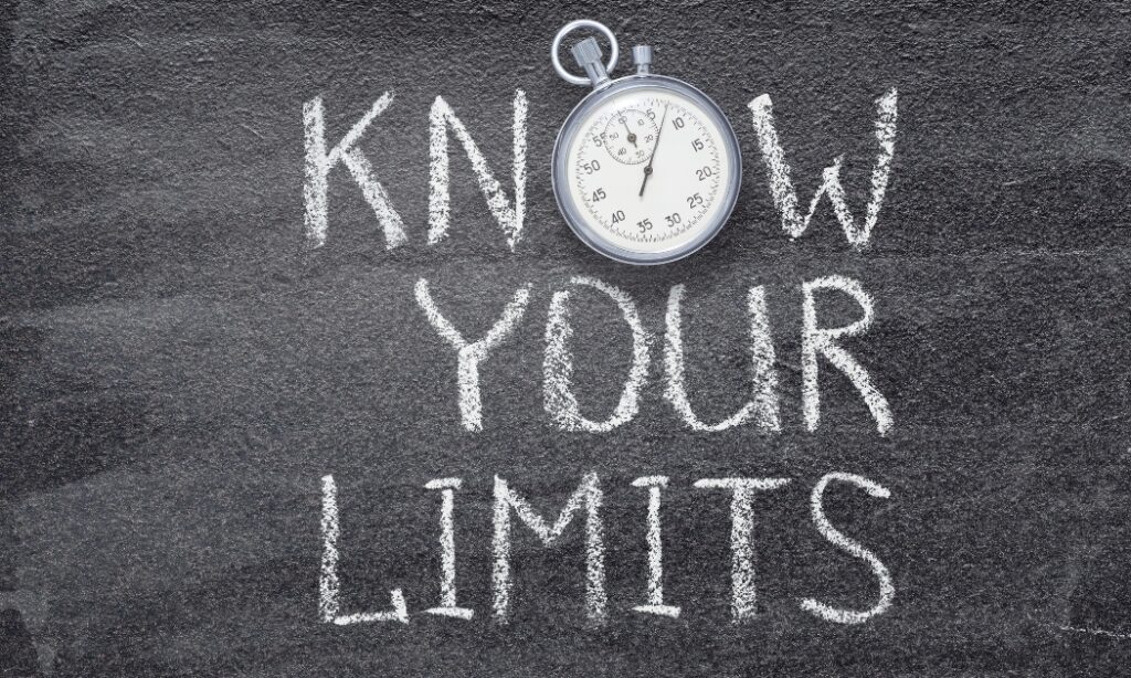 a chalkboard that reads "know your limits," except the "O" in "know" is a a stopwatch