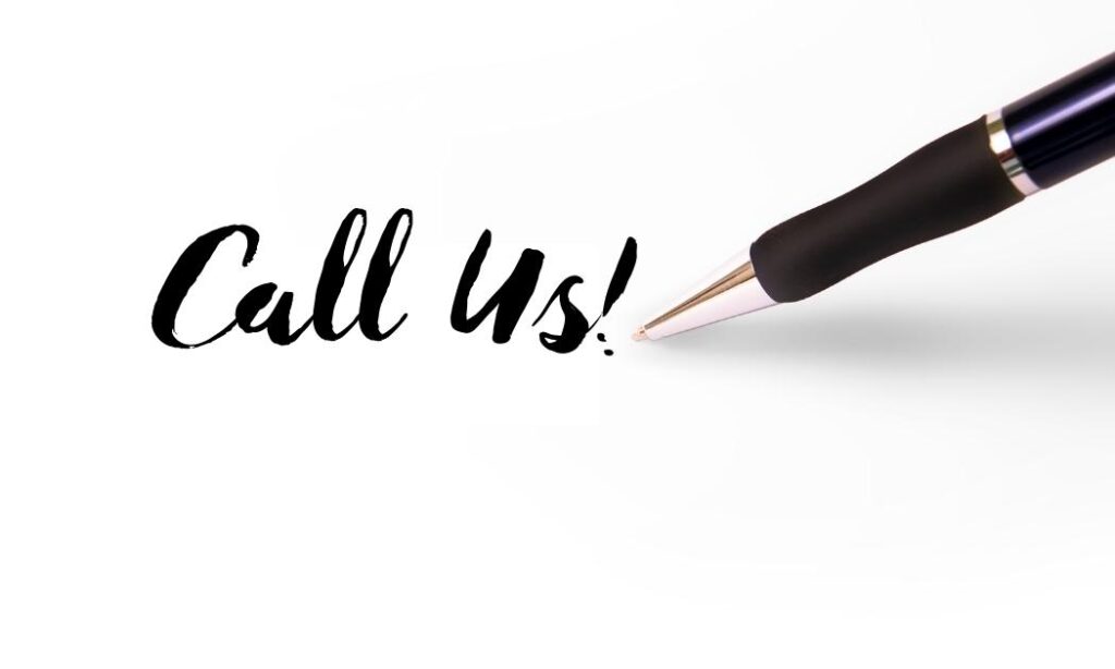 a pen writing "call us!" on a white piece of paper