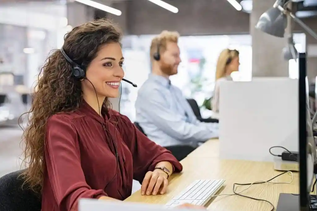 woman at a call center with a headset on