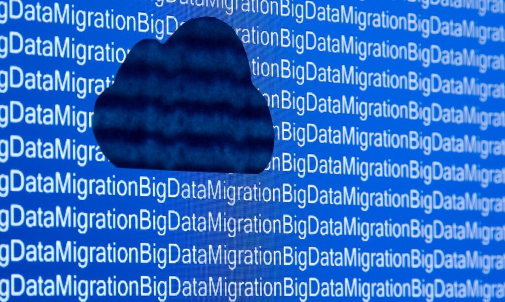 a screen that repeatedly says "big data migration" with a black cloud shape blurring some of the words