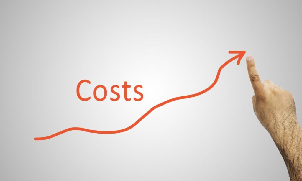 mans hand tracing a red line showing rising costs